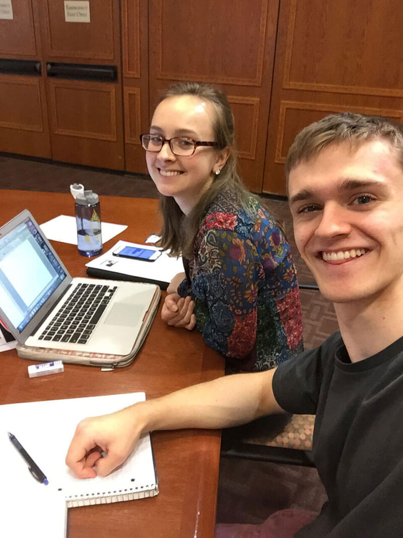 Students studying in Rush Rhees Library